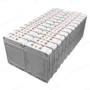 Row after row of white battery modules secured in a metal rack, forming a large stationary battery pack.